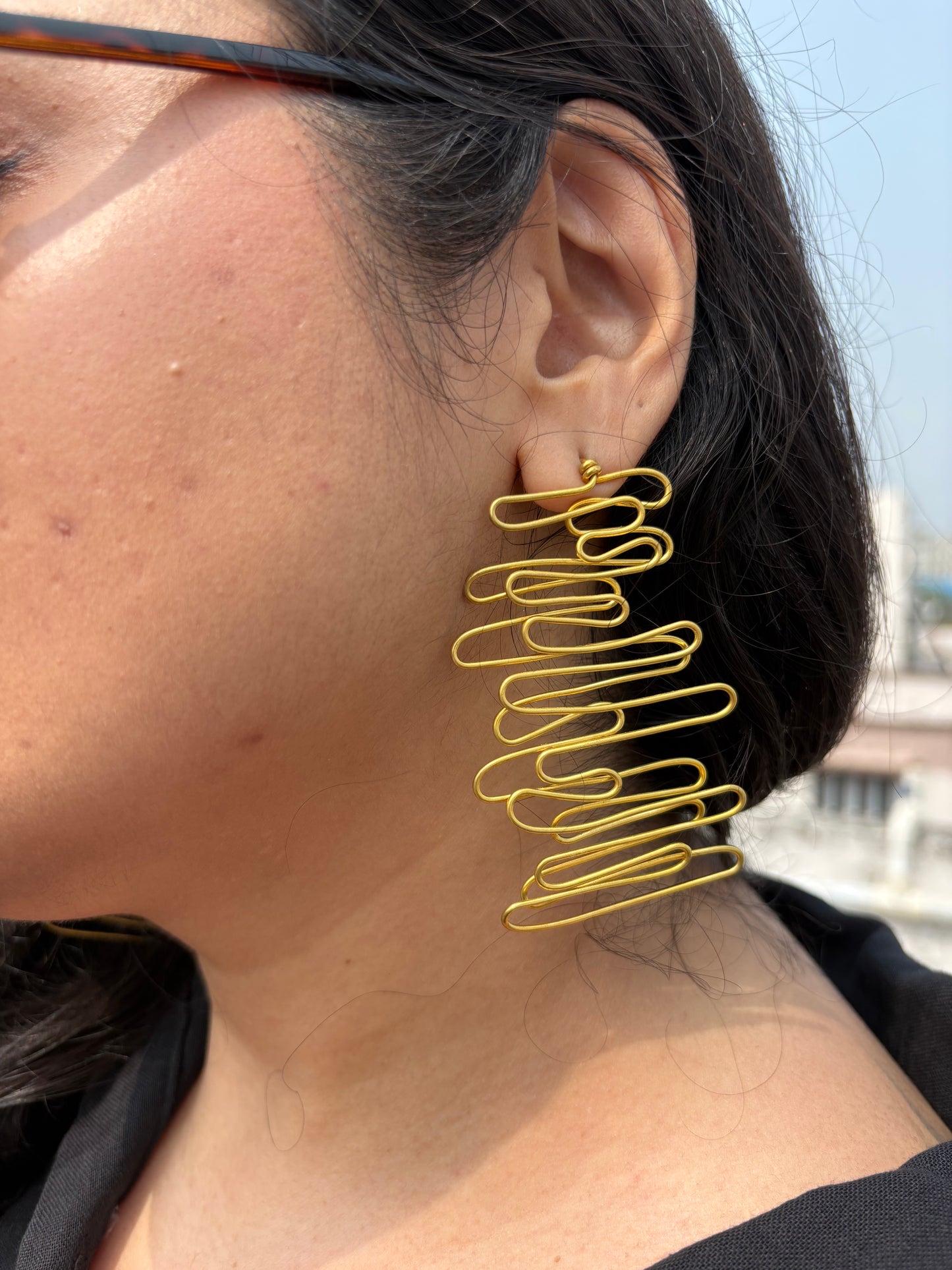 crisscross-long-brass-earrings
