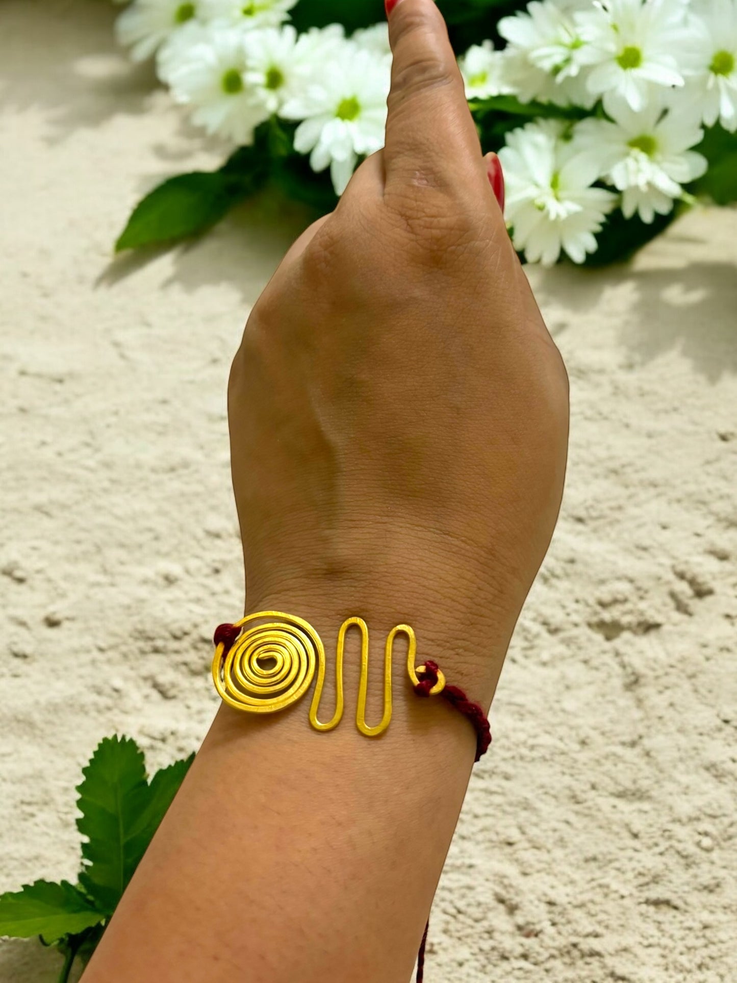 Spiral Wave Forever Brass Rakhi- Maroon