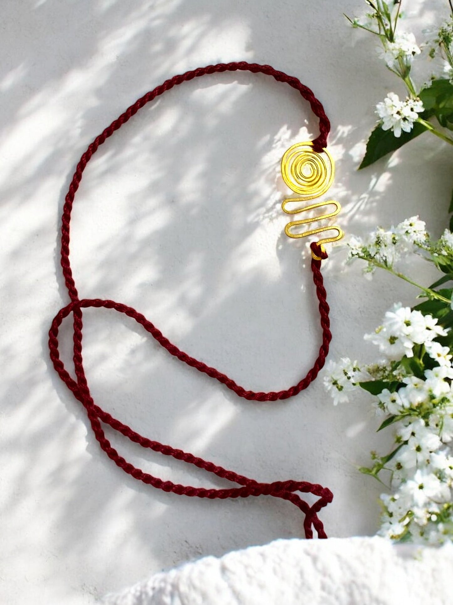 Spiral Wave Forever Brass Rakhi- Maroon