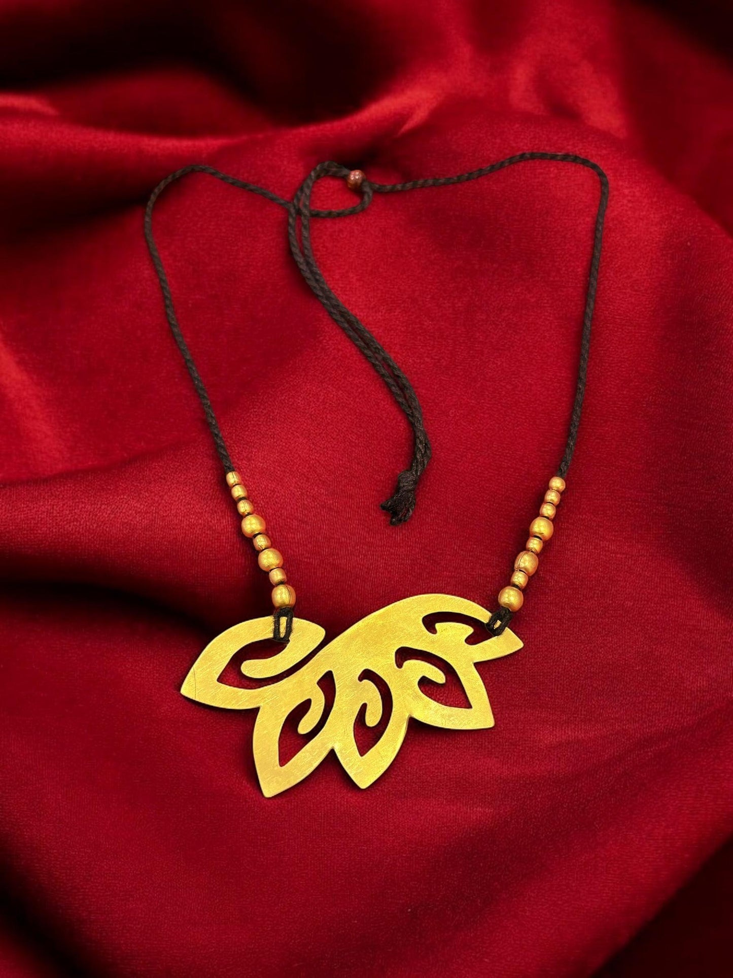 floral-cutout-brass-black-tassel-necklace