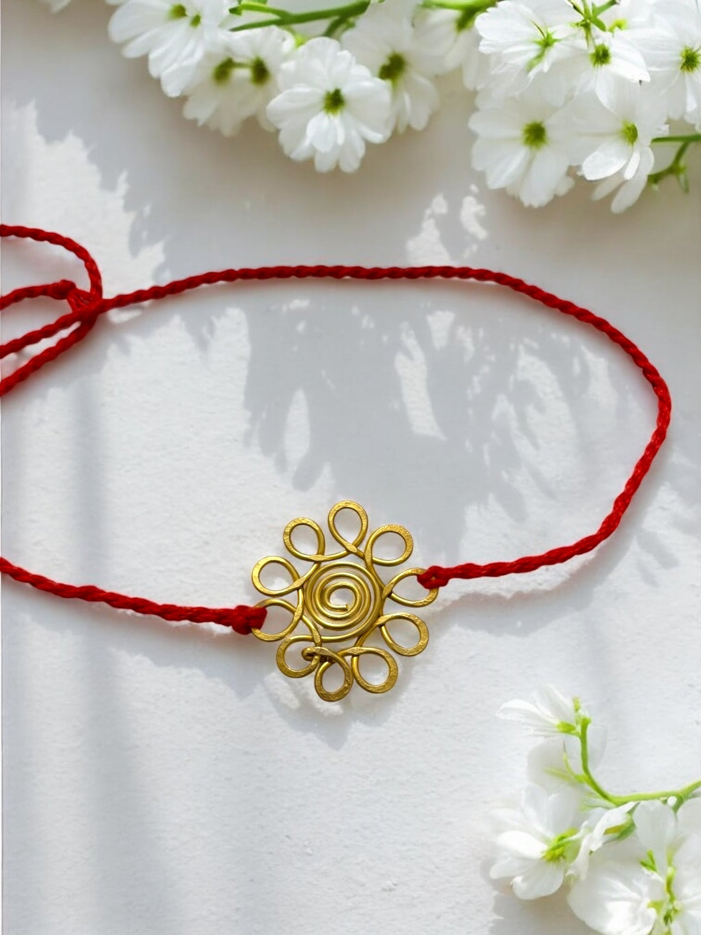 Spiral Flower Forever Brass Rakhi - Red