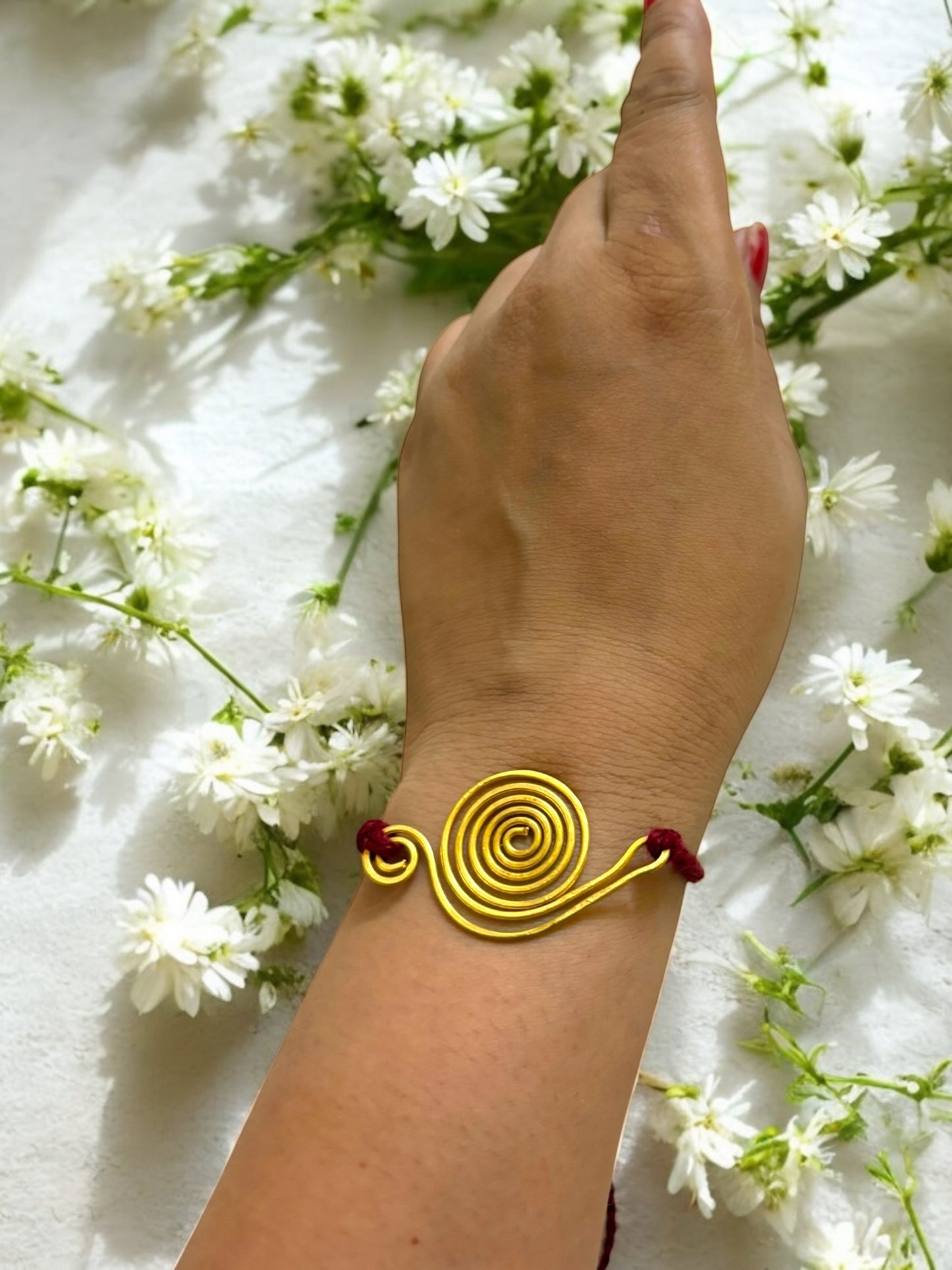 Spiral Song Forever Brass Rakhi - Maroon