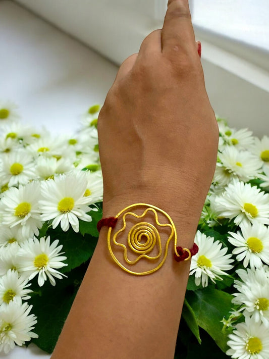 Floral Circle Forever Brass Rakhi - Maroon