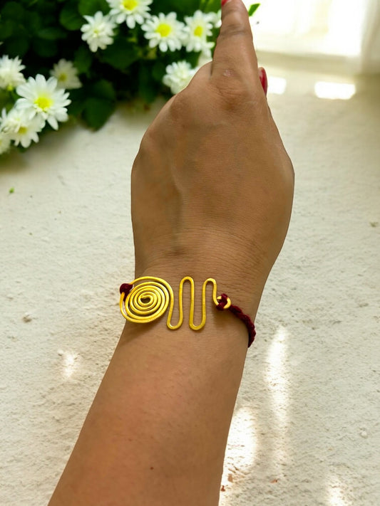 Spiral Wave Forever Brass Rakhi- Maroon