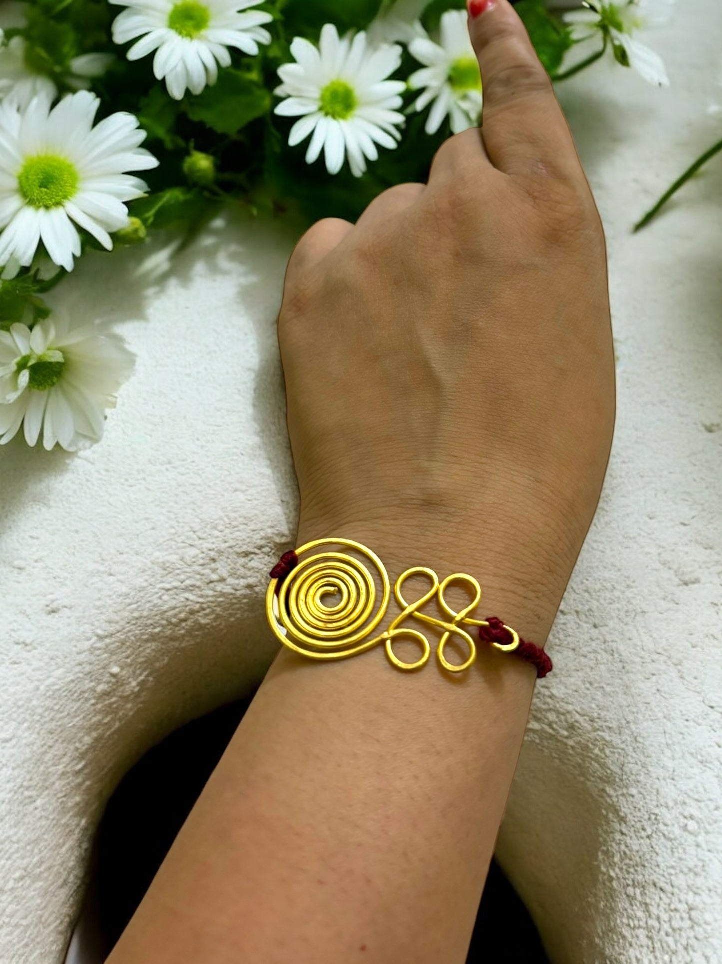 Curly Spiral Forever Brass Rakhi - Maroon
